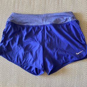 Purple Nike running shorts